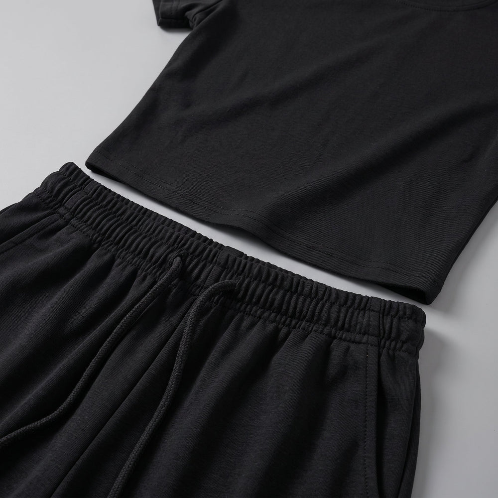 Completo due pezzi da donna con top arricciato e pantalone a gamba larga