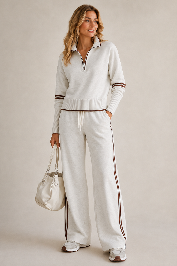 Coordinato in maglia con maglione a zip e pantaloni a gamba larga, vista frontale