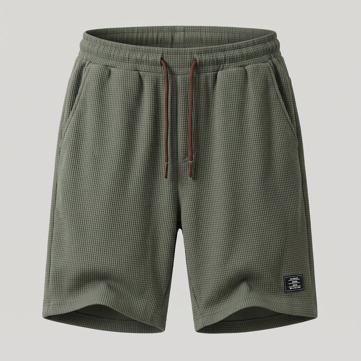 Vista posteriore degli shorts slim fit da uomo con vita elastica